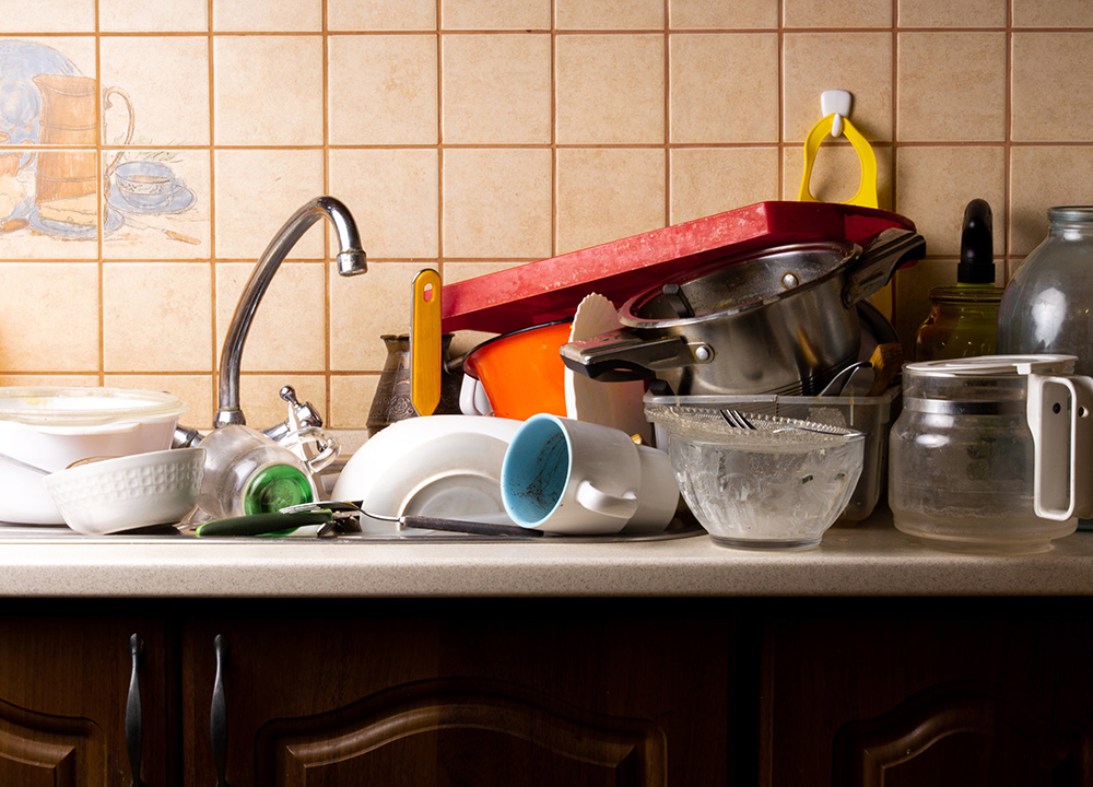 dirty dishes in kitchen sink in San Antonio home